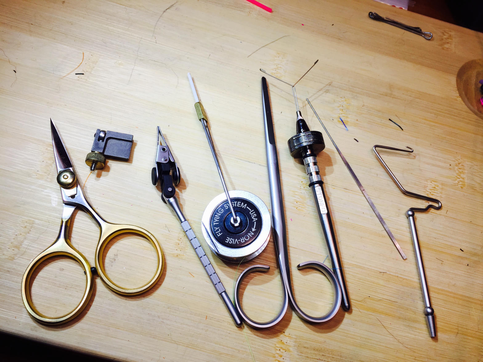 Fly tying tools on a bench